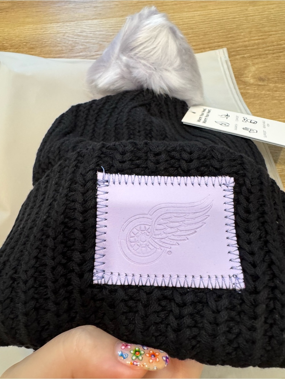Love Your Melon Black Knit Pom Beanie with Lavender Detroit Red Wings Patch